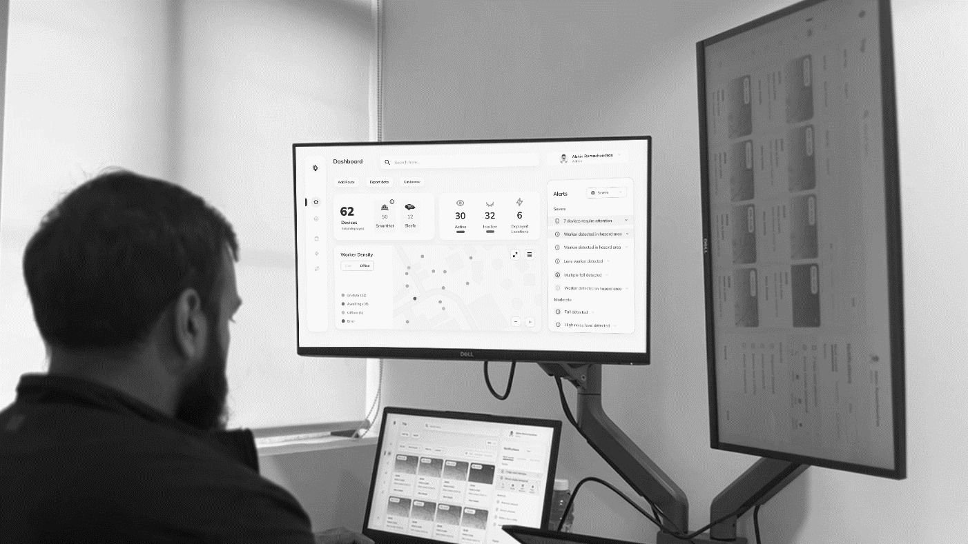 Operator monitoring the assist.live dashboard on multiple screens